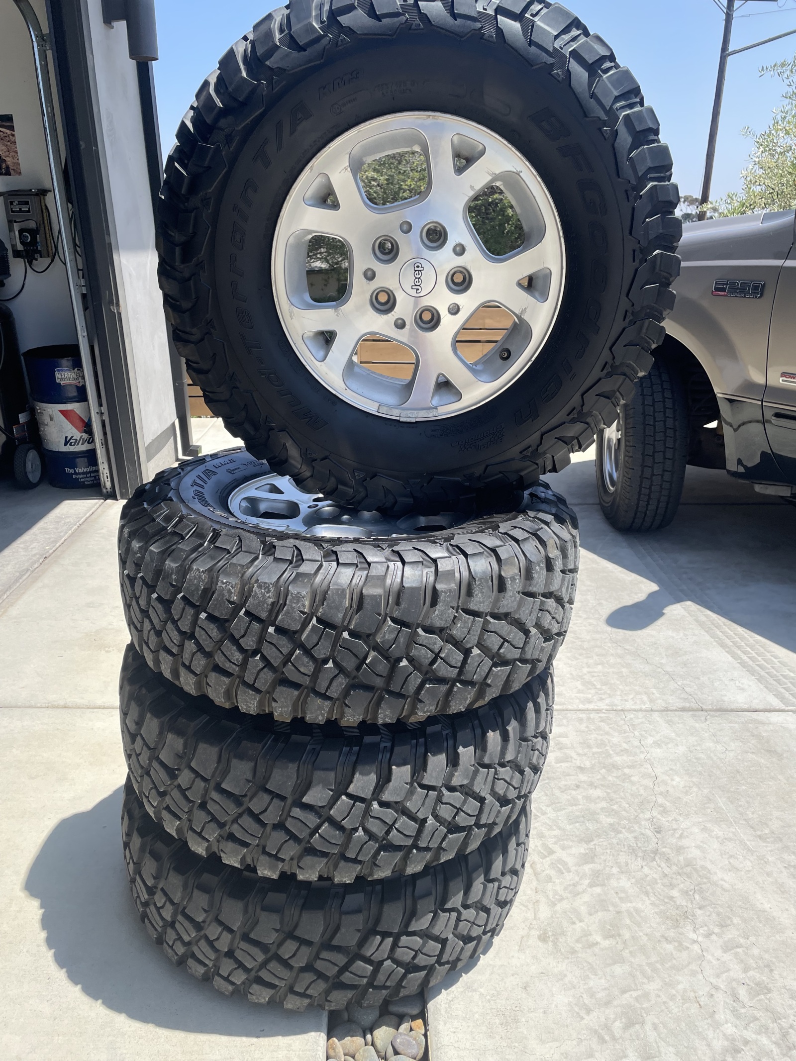 For Sale: 4 BFG Mud Terrain KM3 Tires on jeep wheels 265/75/16 600 miles on them max - photo0